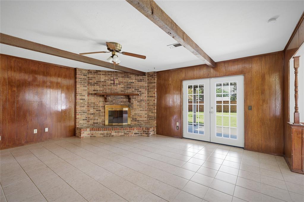 403 Daisy Drive Allen, TX 75013 - Photo 10 of 16 a view of an empty room with brick walls and windows