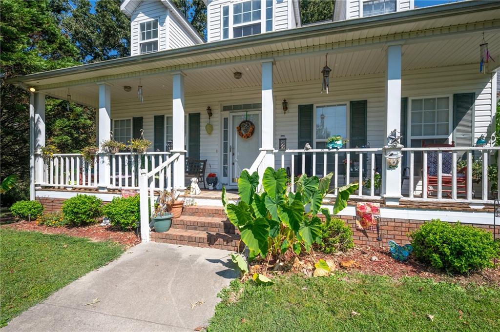 2467 Owens Gin Road Northeast Resaca, GA 30735 - Photo 12 of 44 front view of a house with a yard