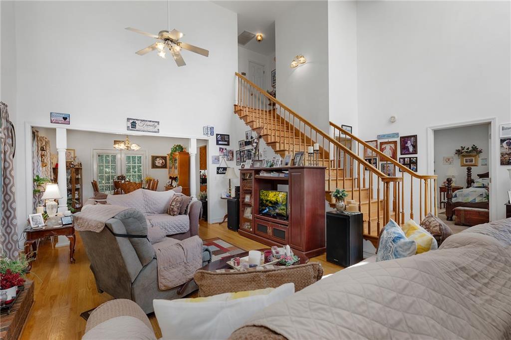 2467 Owens Gin Road Northeast Resaca, GA 30735 - Photo 18 of 44 a living room with fireplace furniture and a wooden floor