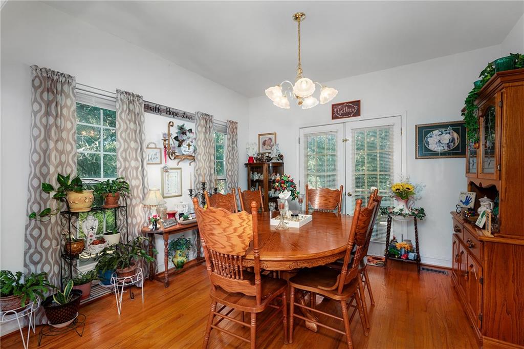 2467 Owens Gin Road Northeast Resaca, GA 30735 - Photo 19 of 44 a view of a dining room with furniture window and wooden floor