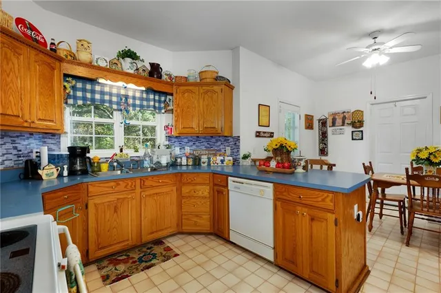 a kitchen with stainless steel appliances a refrigerator and a stove