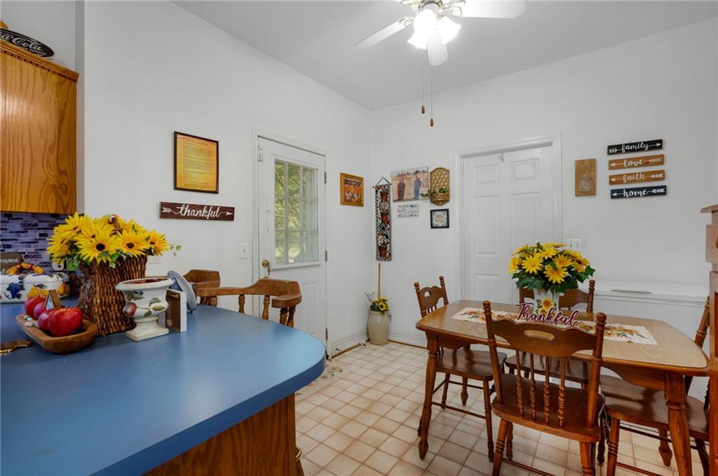 2467 Owens Gin Road Northeast Resaca, GA 30735 - Photo 23 of 44 a dining room with furniture and chandelier