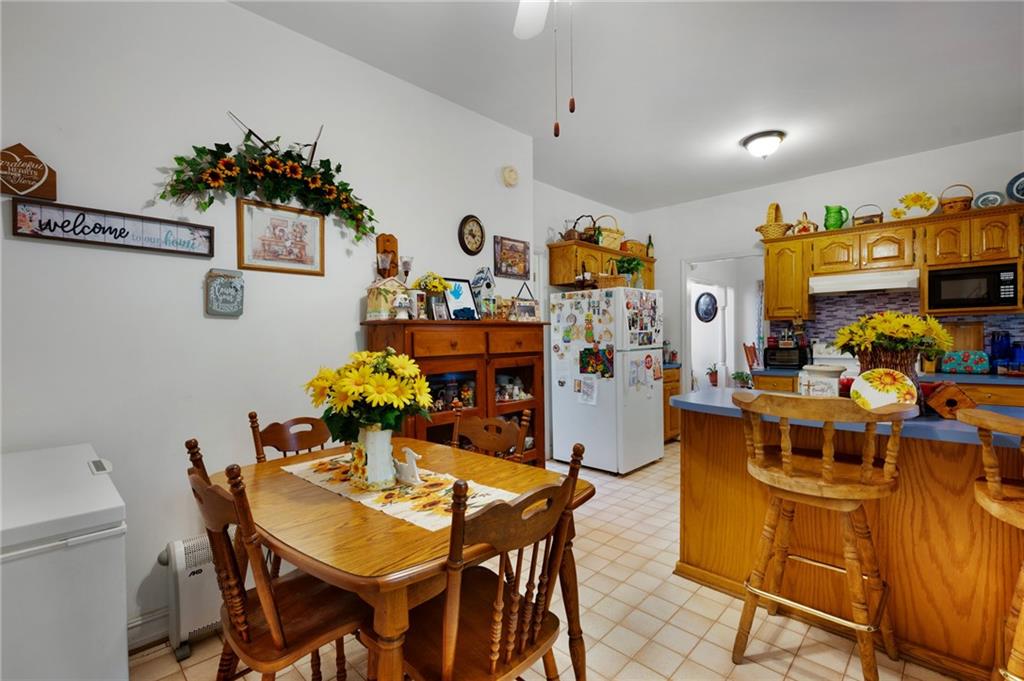 2467 Owens Gin Road Northeast Resaca, GA 30735 - Photo 24 of 44 a dining room with furniture and a chandelier