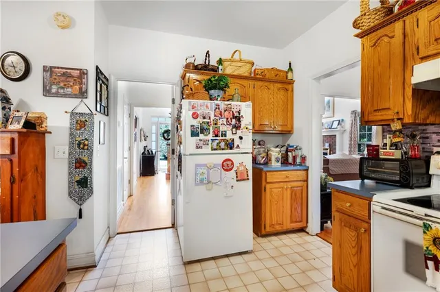 a bedroom that has a bed and a dresser in it