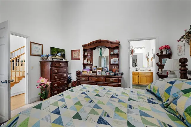 a bathroom with a bathtub and a potted plant