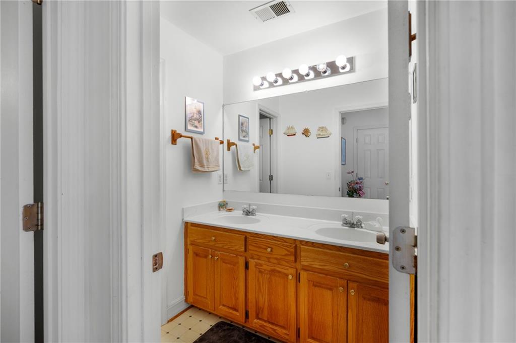 2467 Owens Gin Road Northeast Resaca, GA 30735 - Photo 37 of 44 a bathroom with a sink double vanity
