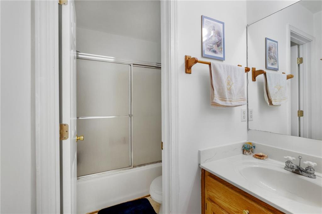 2467 Owens Gin Road Northeast Resaca, GA 30735 - Photo 38 of 44 a bathroom with a sink vanity and shower