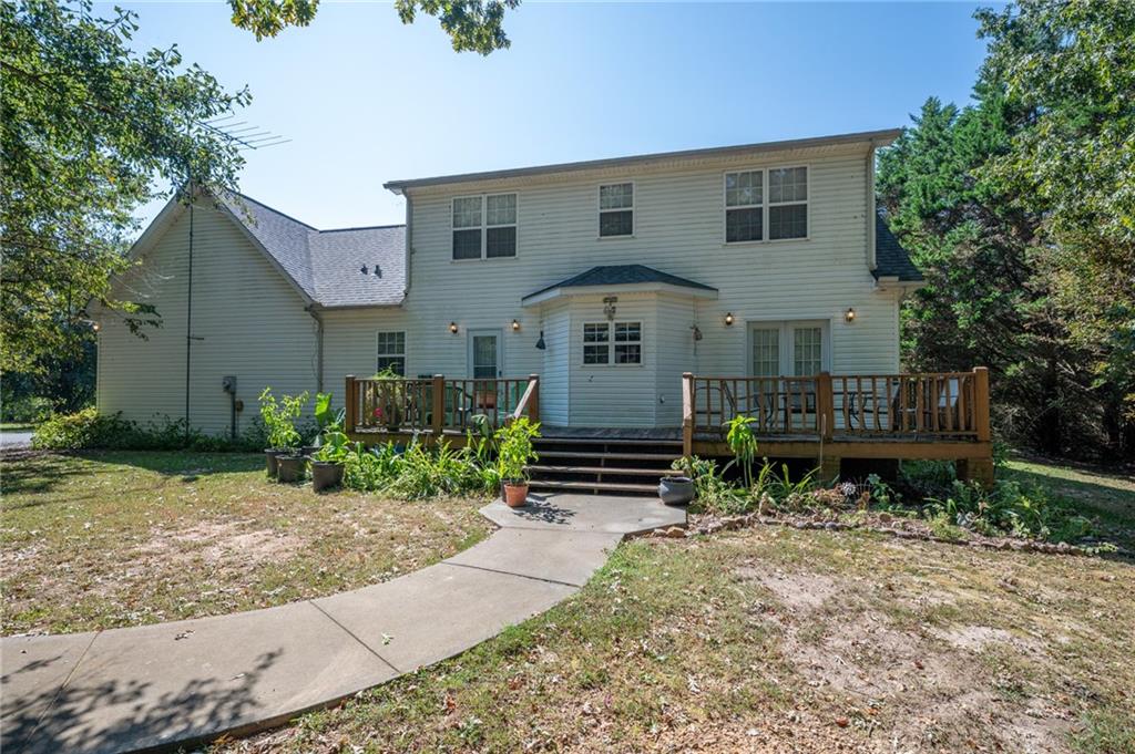 2467 Owens Gin Road Northeast Resaca, GA 30735 - Photo 41 of 44 a front view of a house with garden