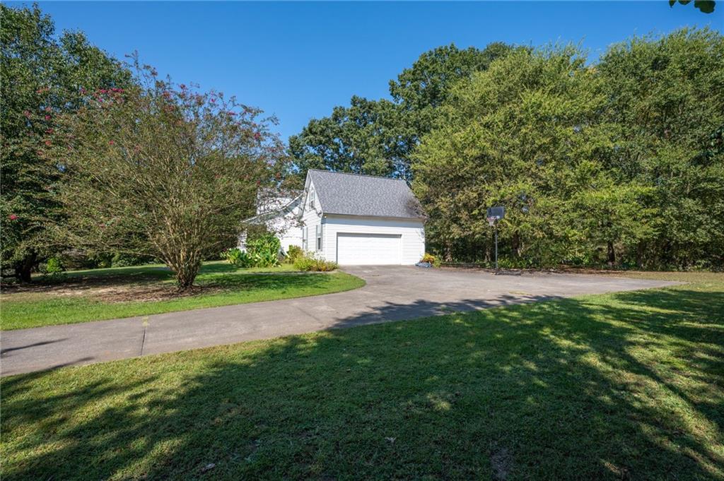2467 Owens Gin Road Northeast Resaca, GA 30735 - Photo 9 of 44 a view of a backyard with large trees