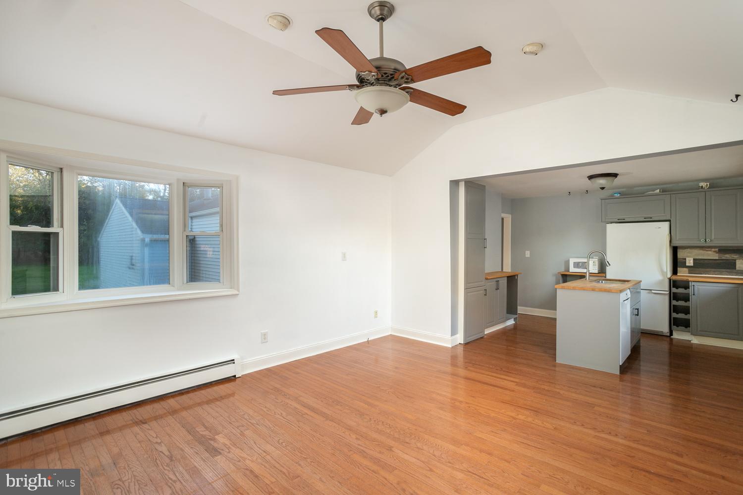 907 Bordentown Road Columbus, NJ 08022 - Photo 11 of 25 a view of a room with wooden floor and a ceiling fan