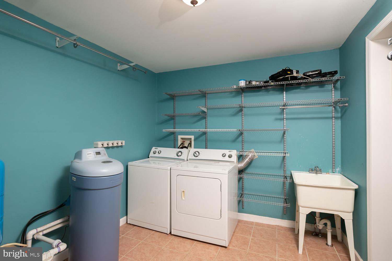 907 Bordentown Road Columbus, NJ 08022 - Photo 19 of 25 a utility room with dryer washer and a view of living room