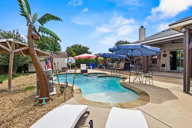 a view of a patio with a table chairs and a patio