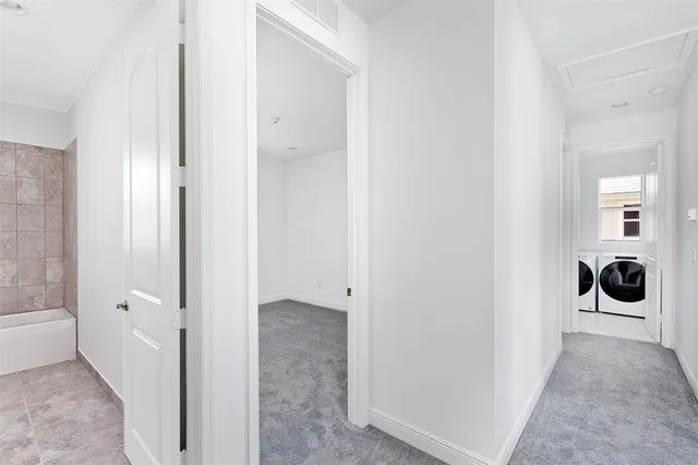 an empty room with sliding door and mountain view