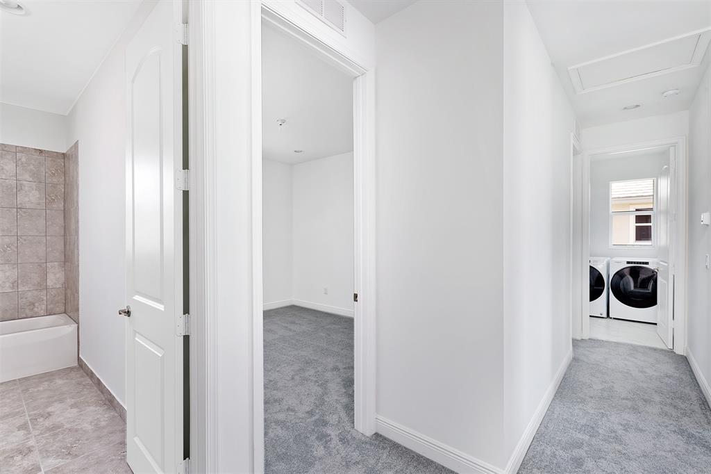 6947 Pines Circle, Unit 21 Pompano Beach, FL 33073 - Photo 18 of 31 a view of a walk in closet and bathroom