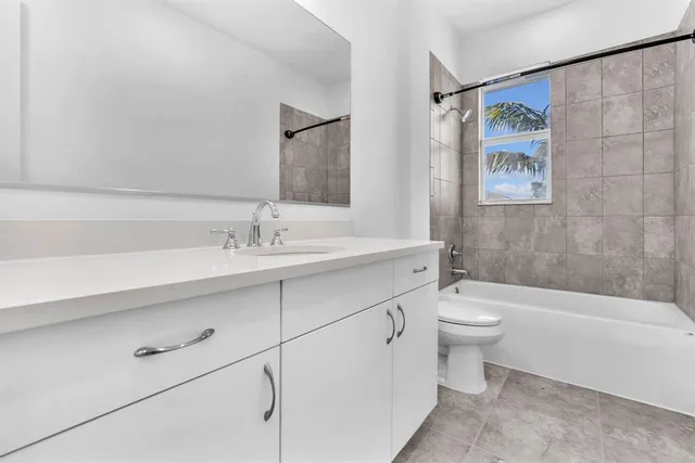 a bathroom with a sink a toilet and a bathtub