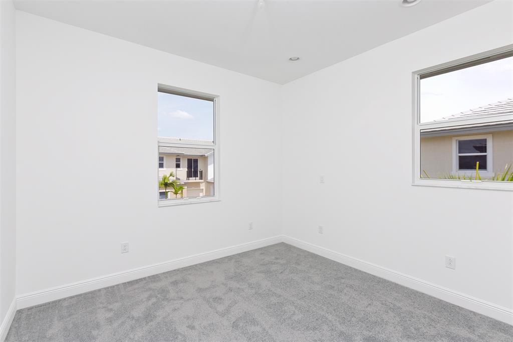 6947 Pines Circle, Unit 21 Pompano Beach, FL 33073 - Photo 29 of 31 an empty room with a window