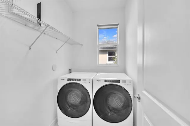 a utility room with dryer and washer