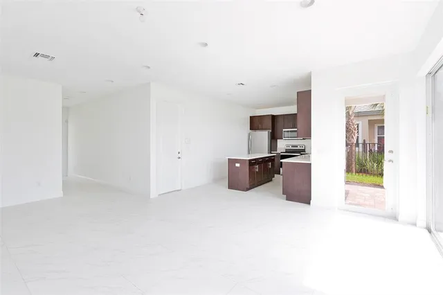 a large white room with kitchen