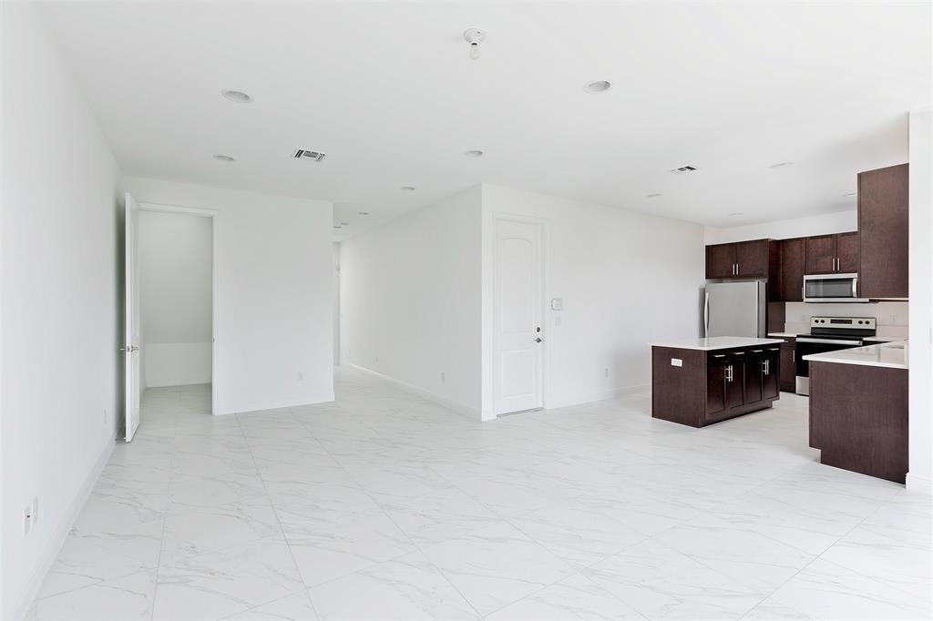 6947 Pines Circle, Unit 21 Pompano Beach, FL 33073 - Photo 8 of 31 a living room with furniture and a flat screen tv
