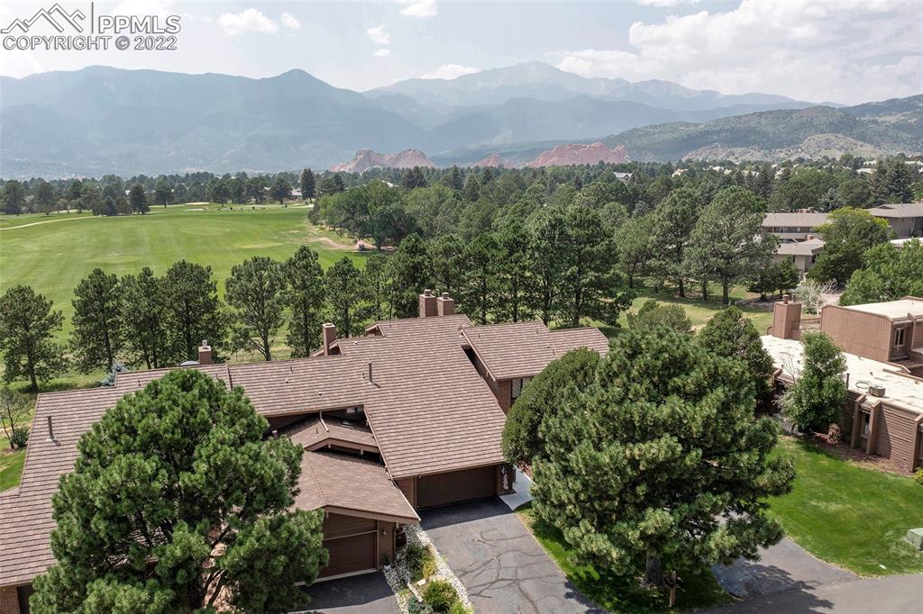 an aerial view of a house with mountain view