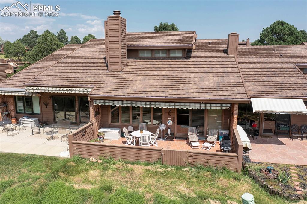 3670 Camels Ridge Lane Colorado Springs, CO 80904 - Photo 12 of 22 a view of a house with a yard patio and swimming pool