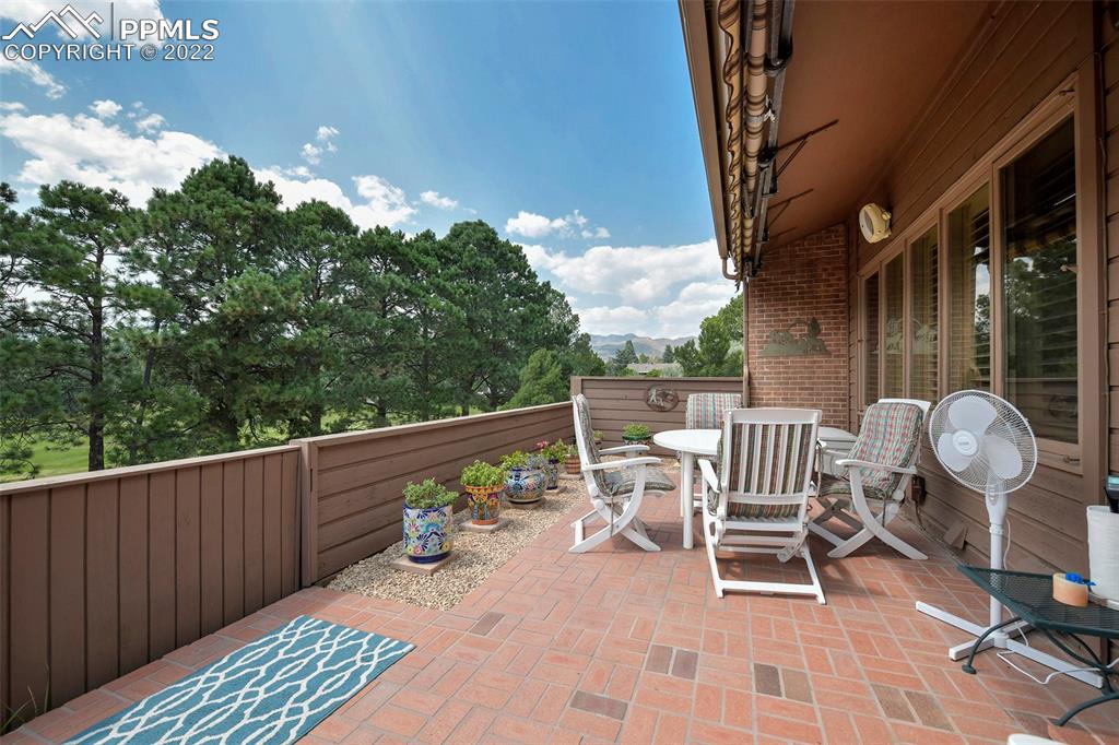3670 Camels Ridge Lane Colorado Springs, CO 80904 - Photo 13 of 22 a view of a chairs and table in the roof deck