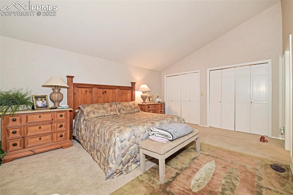 3670 Camels Ridge Lane Colorado Springs, CO 80904 - Photo 16 of 22 a bedroom with a bed and a dresser