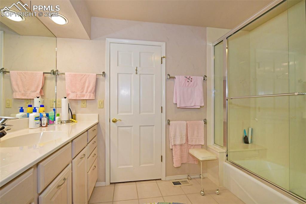 3670 Camels Ridge Lane Colorado Springs, CO 80904 - Photo 20 of 22 a bathroom with a sink a toilet and shower