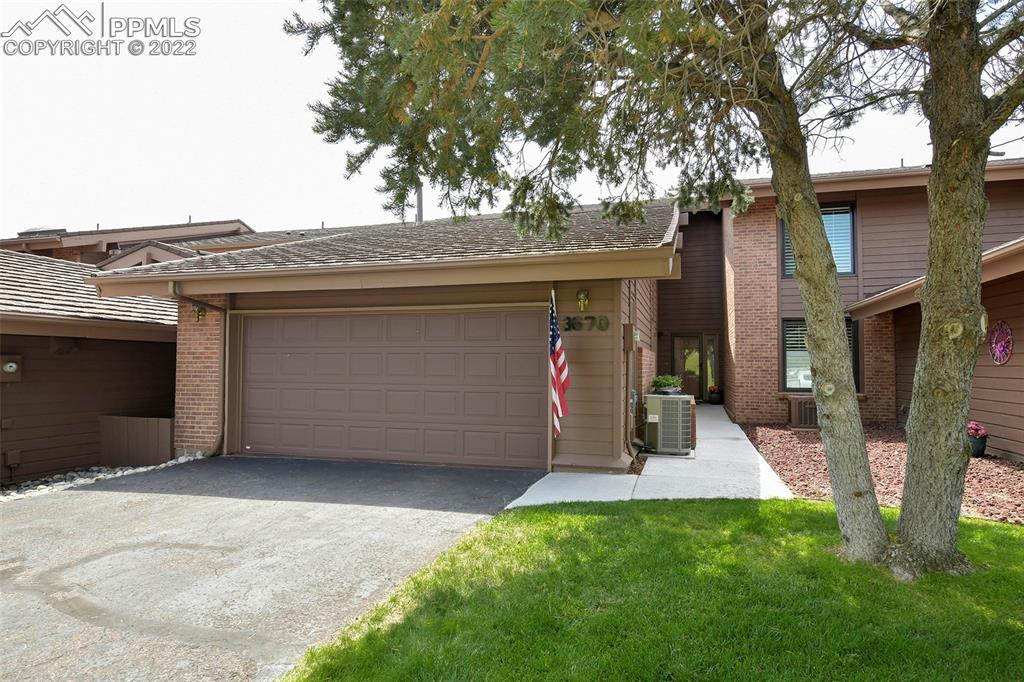 3670 Camels Ridge Lane Colorado Springs, CO 80904 - Photo 2 of 22 a view of a house with a garage