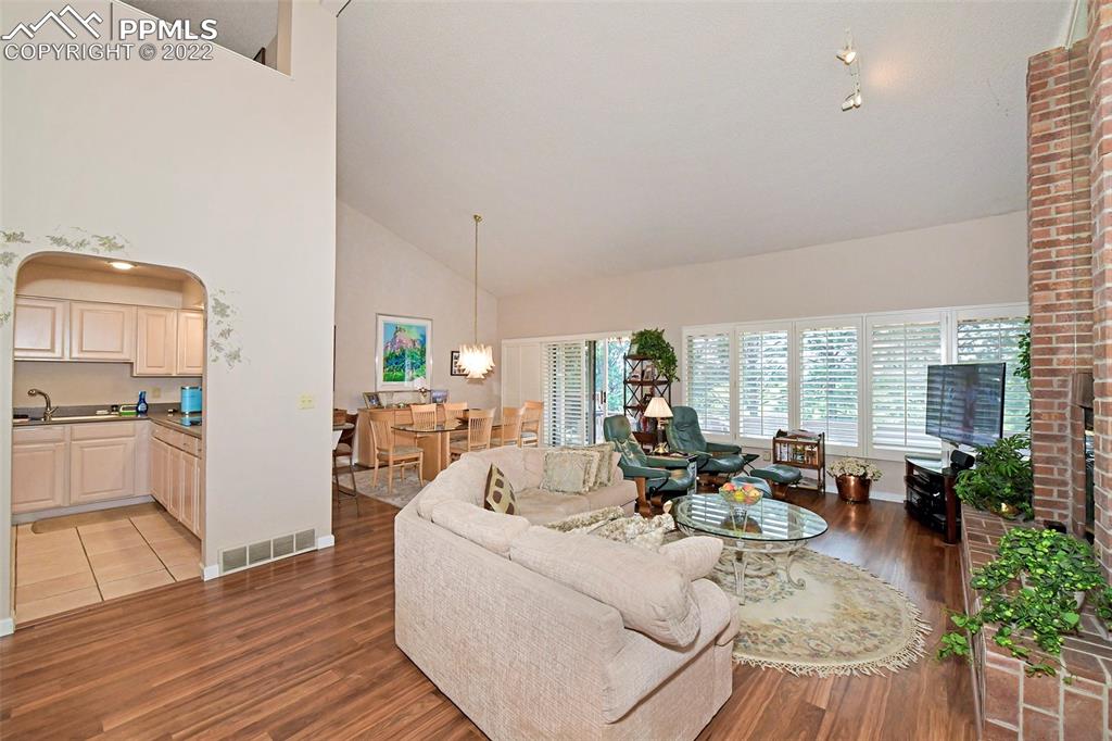 3670 Camels Ridge Lane Colorado Springs, CO 80904 - Photo 5 of 22 a living room with furniture large window and wooden floor