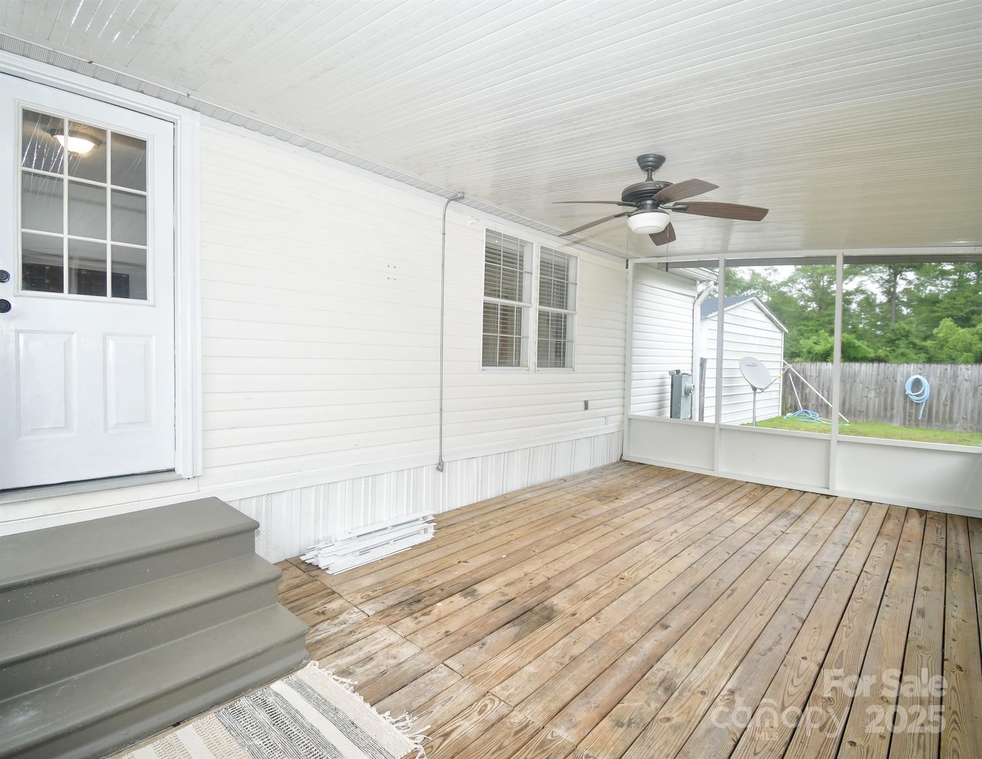 9552 Flat Creek Road Kershaw, SC 29067 - Photo 12 of 47 a view of empty room with wooden floor and fan