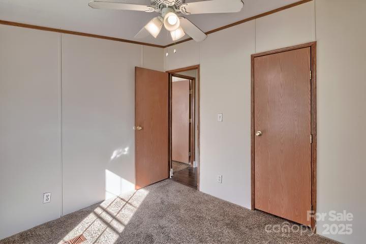 9552 Flat Creek Road Kershaw, SC 29067 - Photo 19 of 47 an empty room with closet and a chandelier fan