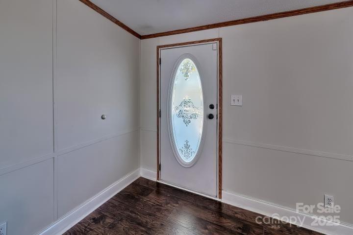 9552 Flat Creek Road Kershaw, SC 29067 - Photo 23 of 47 a view of a hallway with wooden floor