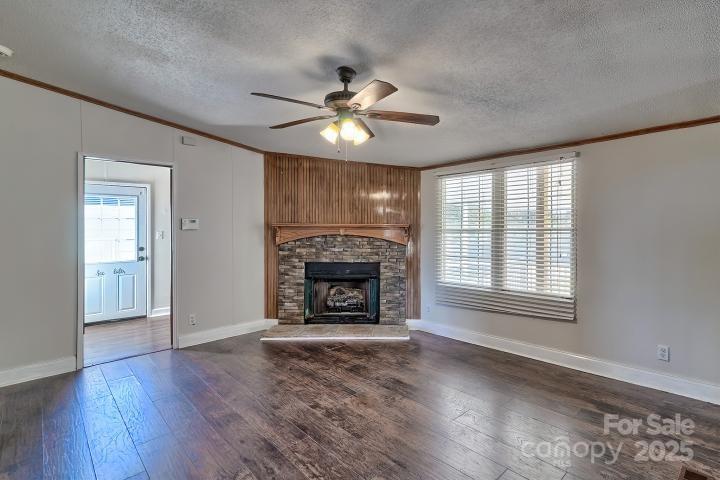 9552 Flat Creek Road Kershaw, SC 29067 - Photo 30 of 47 a view of an empty room with a fireplace and a window