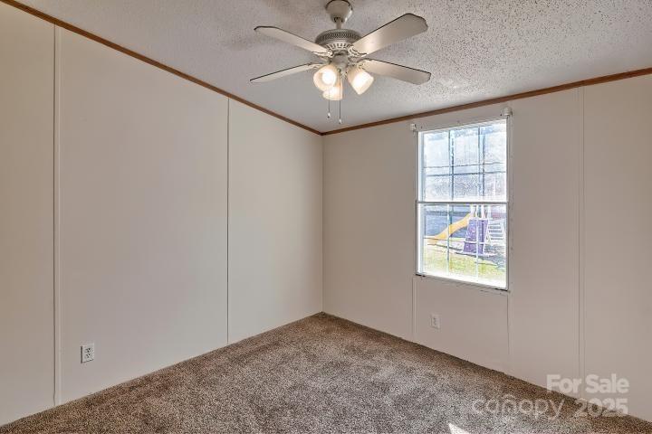 9552 Flat Creek Road Kershaw, SC 29067 - Photo 33 of 47 an empty room with windows and fan