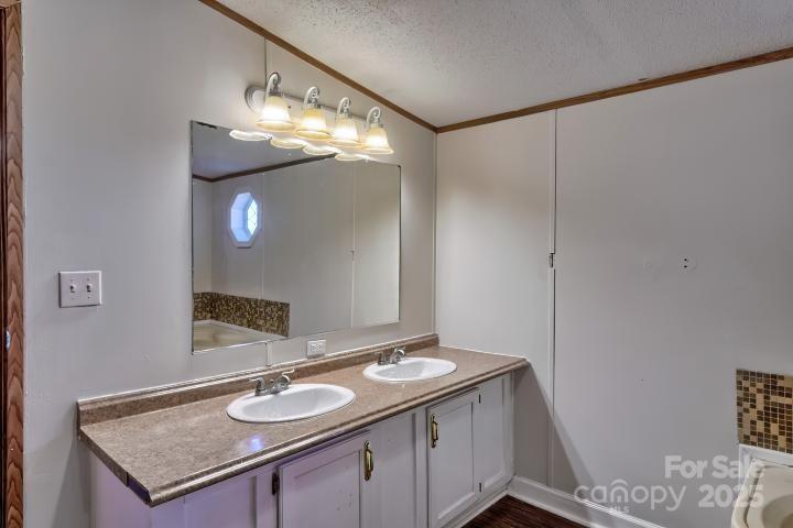 9552 Flat Creek Road Kershaw, SC 29067 - Photo 39 of 47 a bathroom with a sink and a mirror