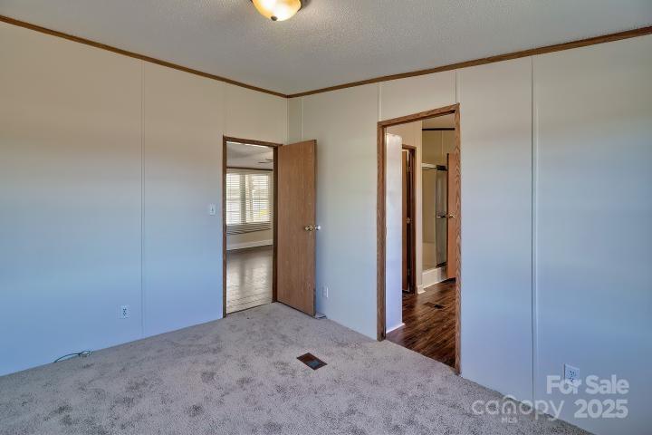 9552 Flat Creek Road Kershaw, SC 29067 - Photo 40 of 47 an empty room with windows and closet
