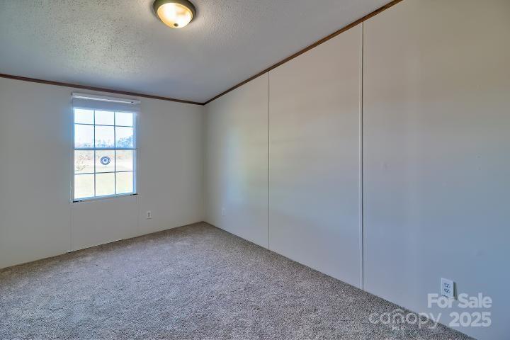 9552 Flat Creek Road Kershaw, SC 29067 - Photo 42 of 47 an empty room with windows and closet