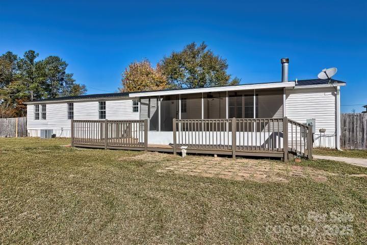 9552 Flat Creek Road Kershaw, SC 29067 - Photo 6 of 47 a view of a house with yard and deck
