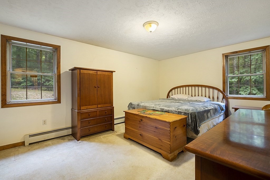 235 Minott Road Westminster, MA 01473 - Photo 15 of 32 a bedroom with a bed and a window