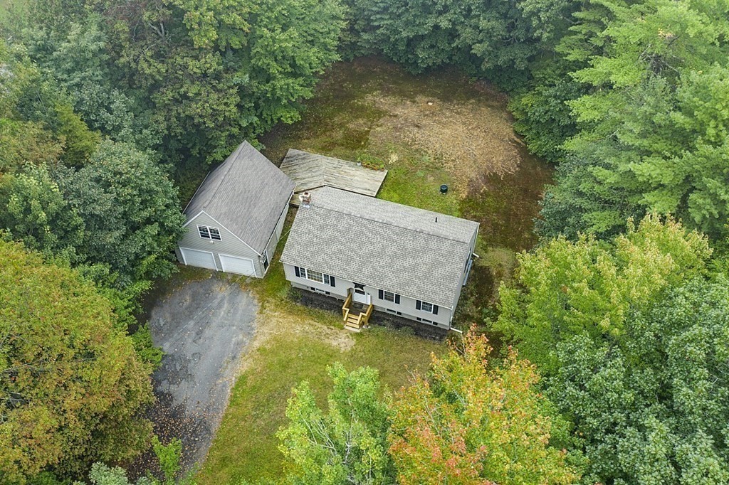235 Minott Road Westminster, MA 01473 - Photo 25 of 32 an aerial view of a house with swimming pool and large trees
