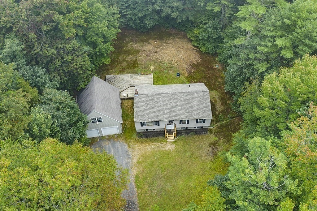 235 Minott Road Westminster, MA 01473 - Photo 26 of 32 an aerial view of a house with swimming pool and large trees