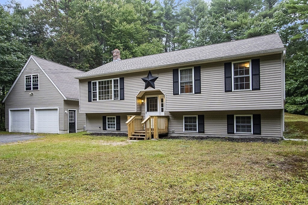 235 Minott Road Westminster, MA 01473 - Photo 3 of 32 a front view of a house with garden