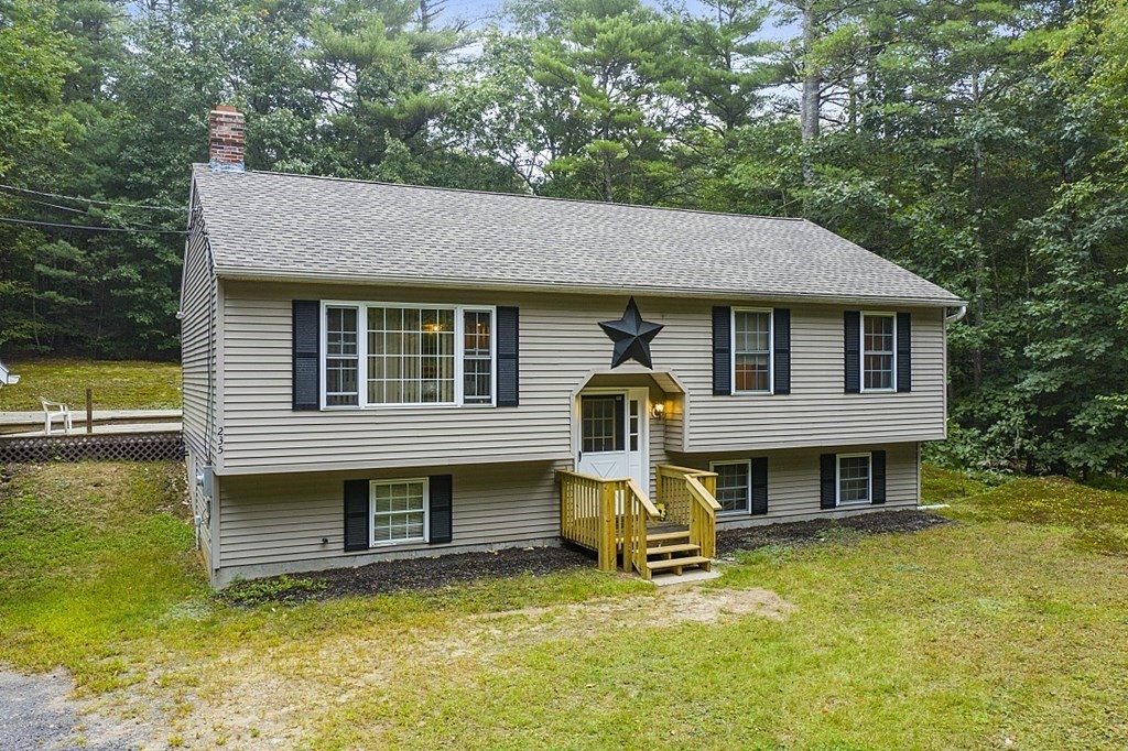 235 Minott Road Westminster, MA 01473 - Photo 32 of 32 a backyard of a house with table and chairs