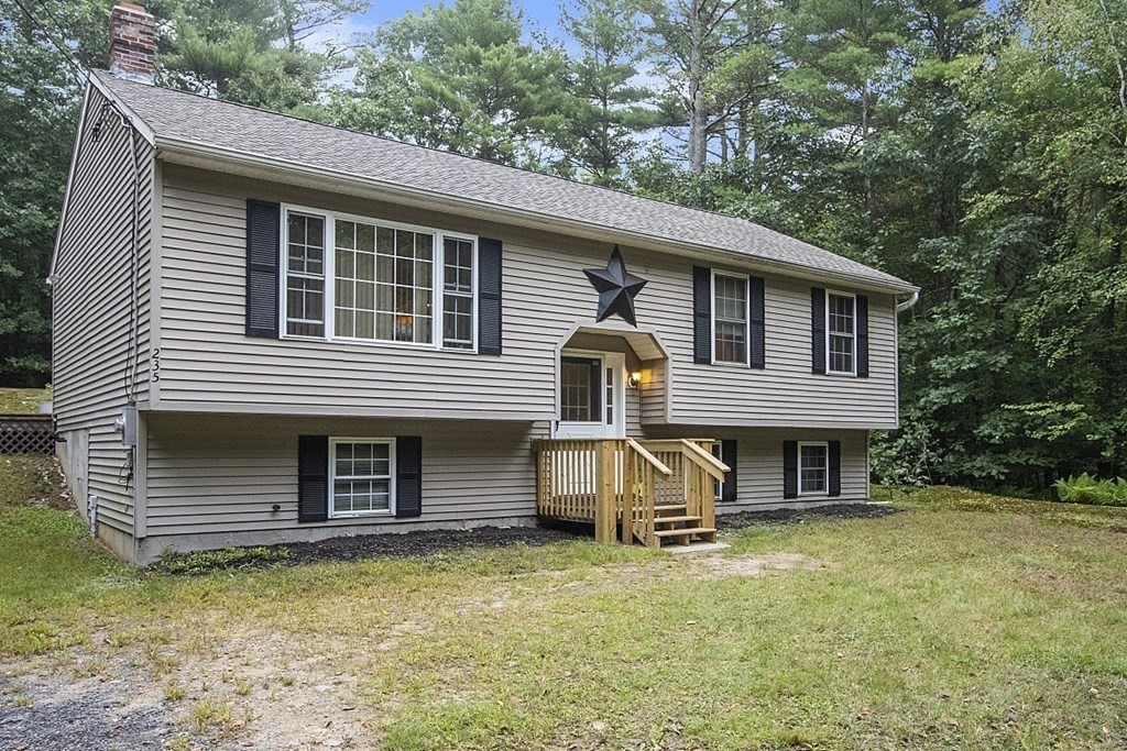 235 Minott Road Westminster, MA 01473 - Photo 4 of 32 a front view of a house with a yard