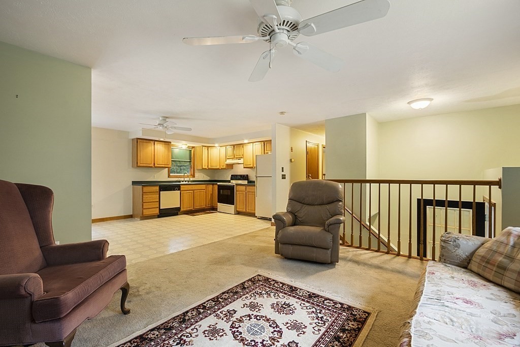 235 Minott Road Westminster, MA 01473 - Photo 8 of 32 a living room with furniture and a rug