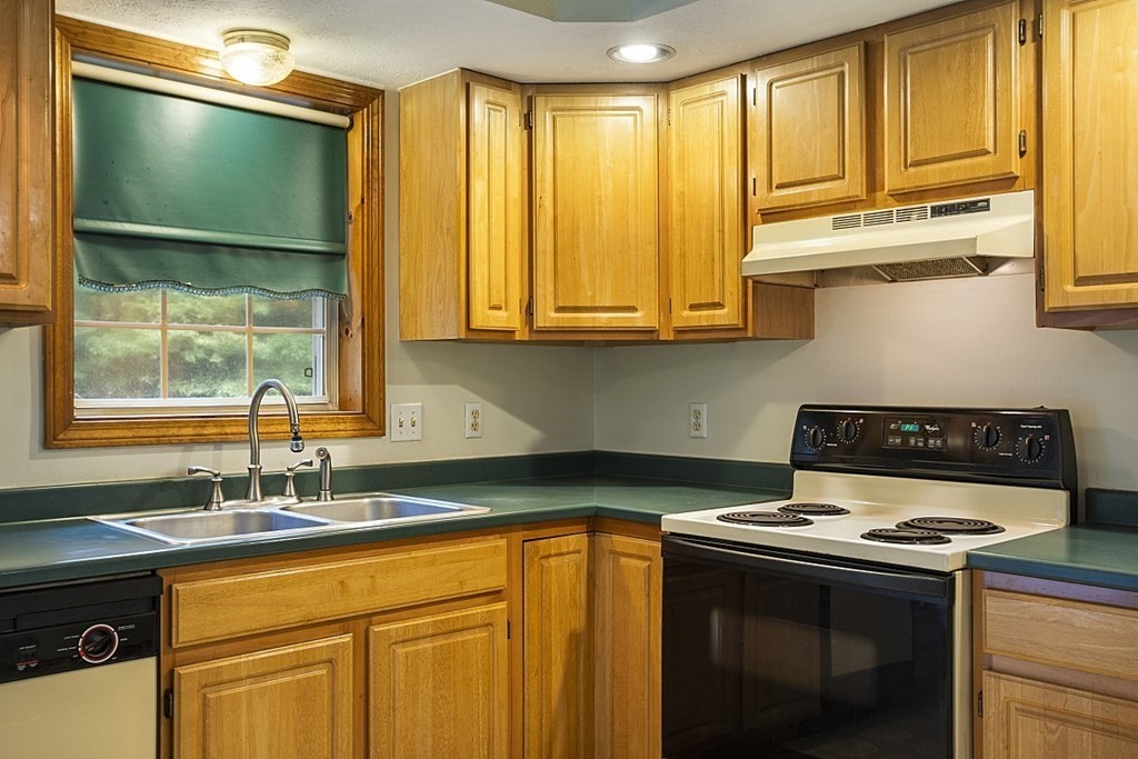 235 Minott Road Westminster, MA 01473 - Photo 10 of 32 a kitchen with stainless steel appliances a stove a sink and a microwave