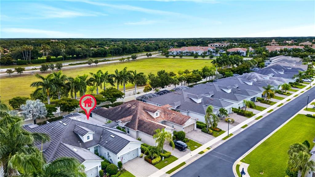 20105 Torch Key Way Estero, FL 33928 - Photo 24 of 29 an aerial view of residential houses with outdoor space and ocean view