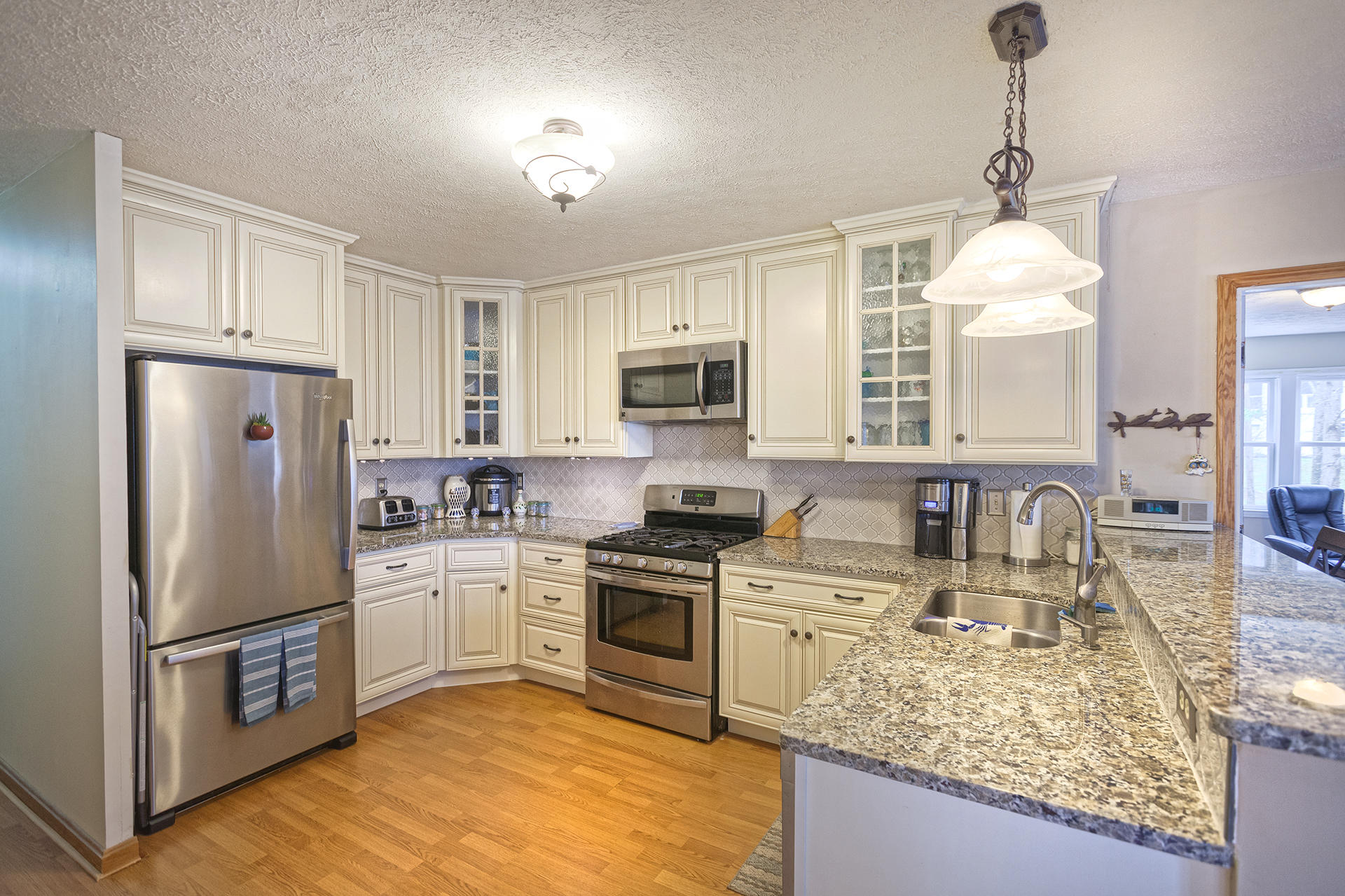 699 Highland Lake Road Union Hall, VA 24176 - Photo 2 of 33 a kitchen with a sink stove and refrigerator