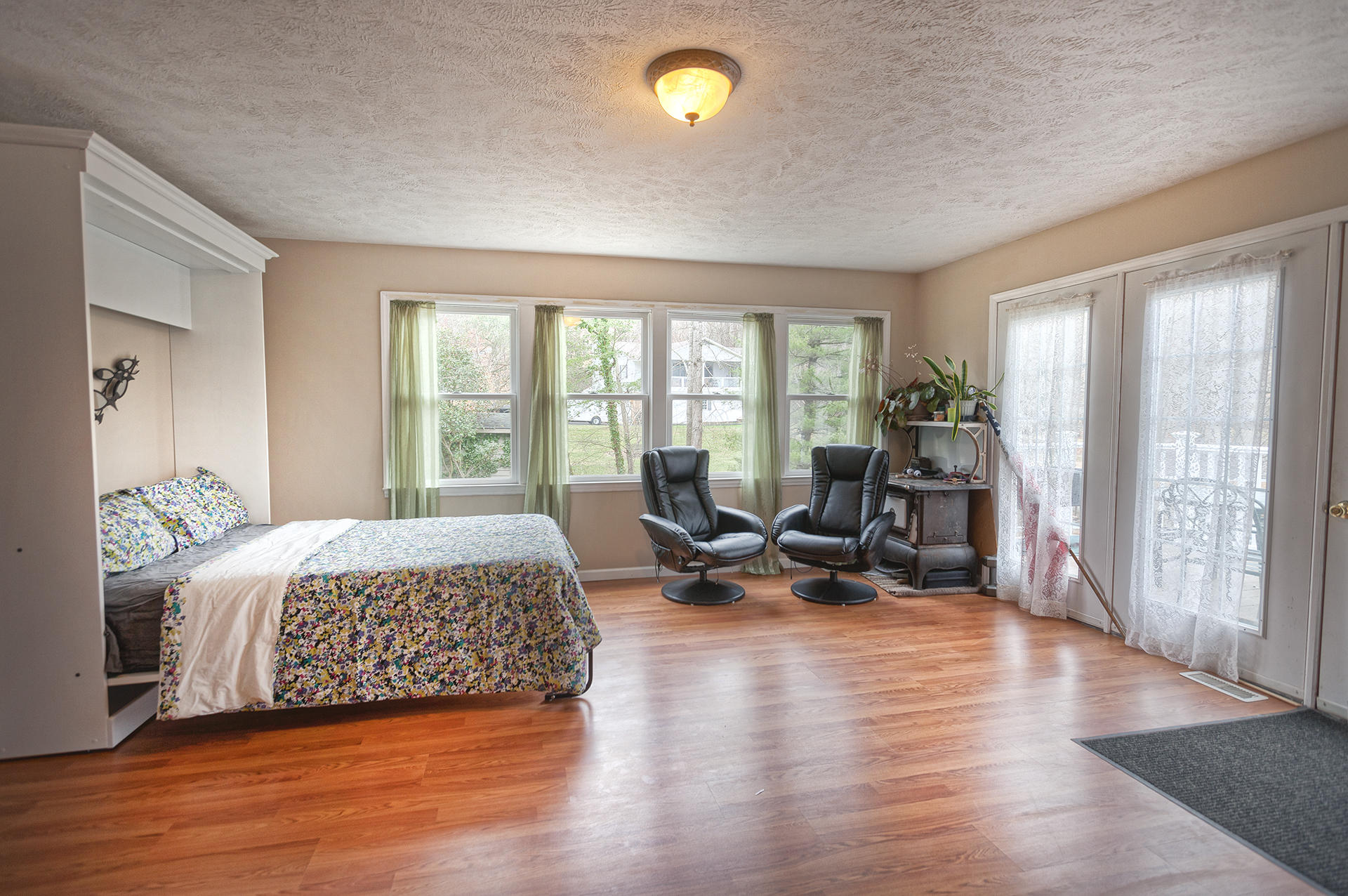699 Highland Lake Road Union Hall, VA 24176 - Photo 11 of 33 a living room with furniture and a wooden floor